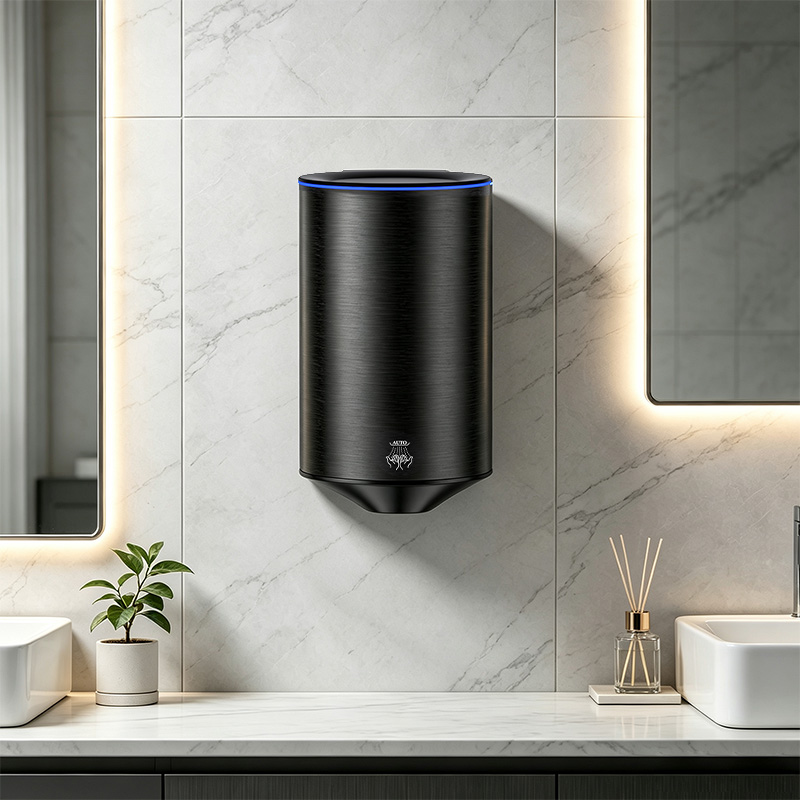 Black stainless steel wall-mounted hand dryer installed in a hotel bathroom for high-traffic commercial washroom projects